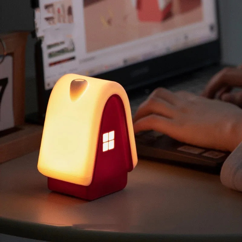 Polar Species igloo baby night light in blue with silicone shade showing touch dimmer and USB cable