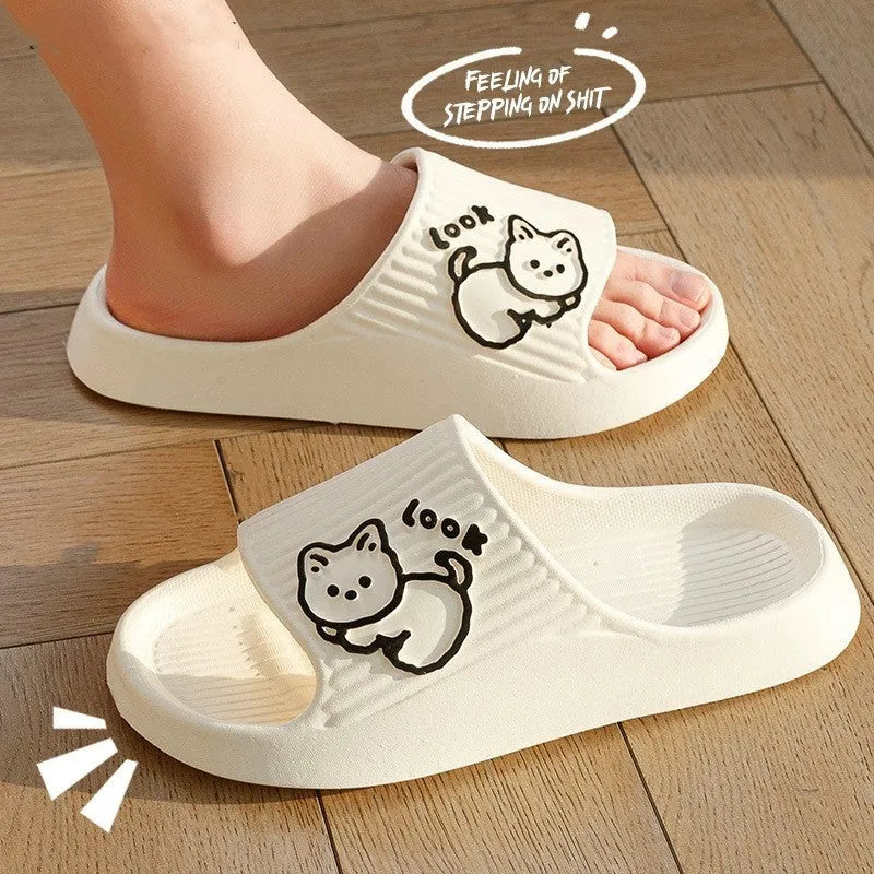 Women's cat platform slippers in pink with thick EVA sole, shown on a wooden floor.