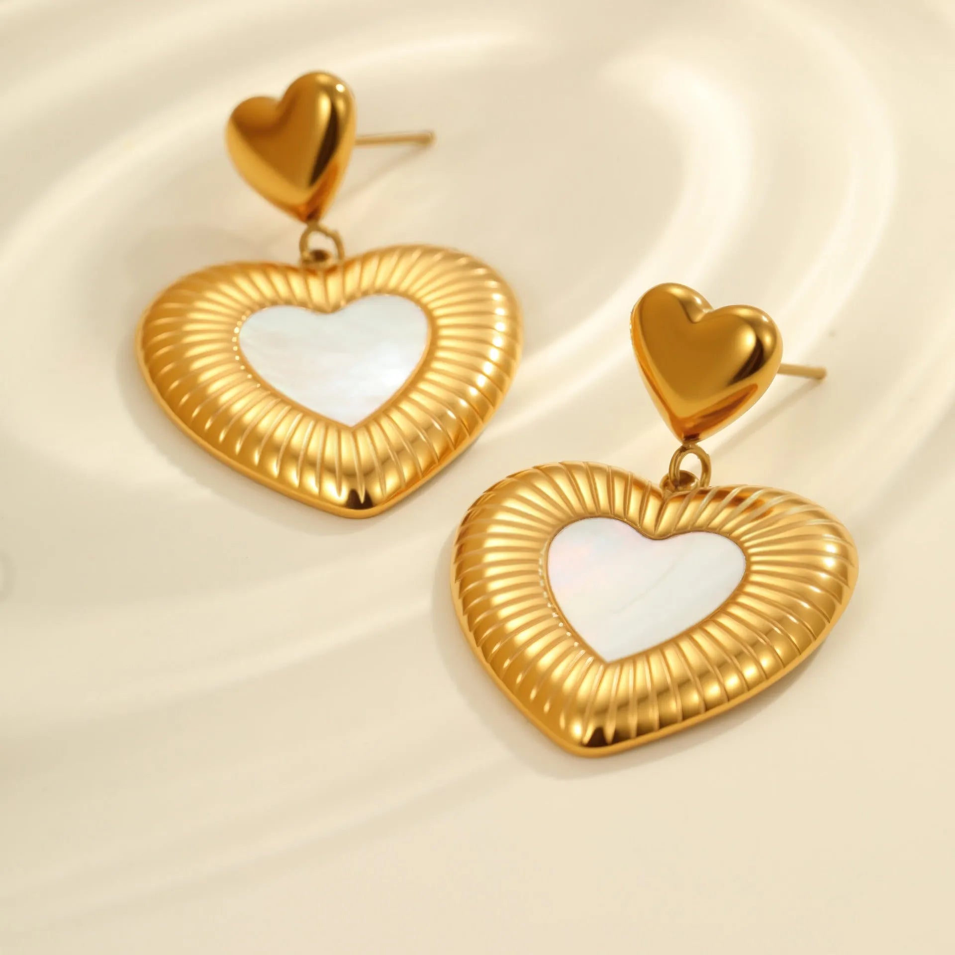 Heart shaped stainless steel earrings with white fritillary pattern and 18K gold electroplated finish for women