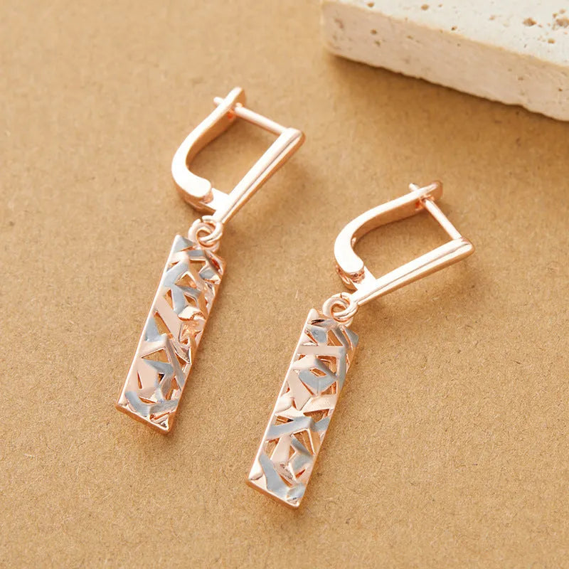 Rectangular two-tone hollow stud earrings with electroplated geometric design