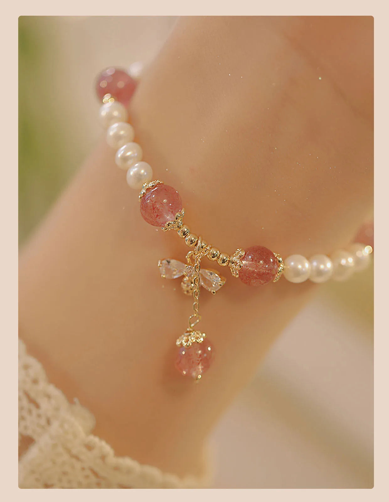 Women's handmade strawberry quartz crystal bracelet with stringed pearls and bow decoration