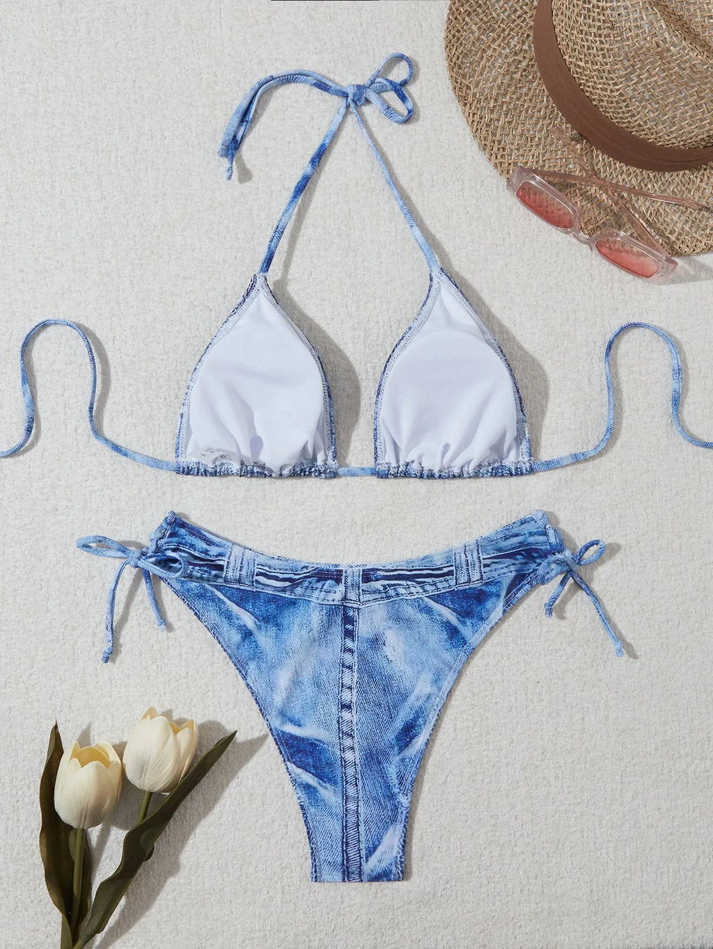 Women's denim blue strappy bikini set with printed design and two-piece swimwear construction