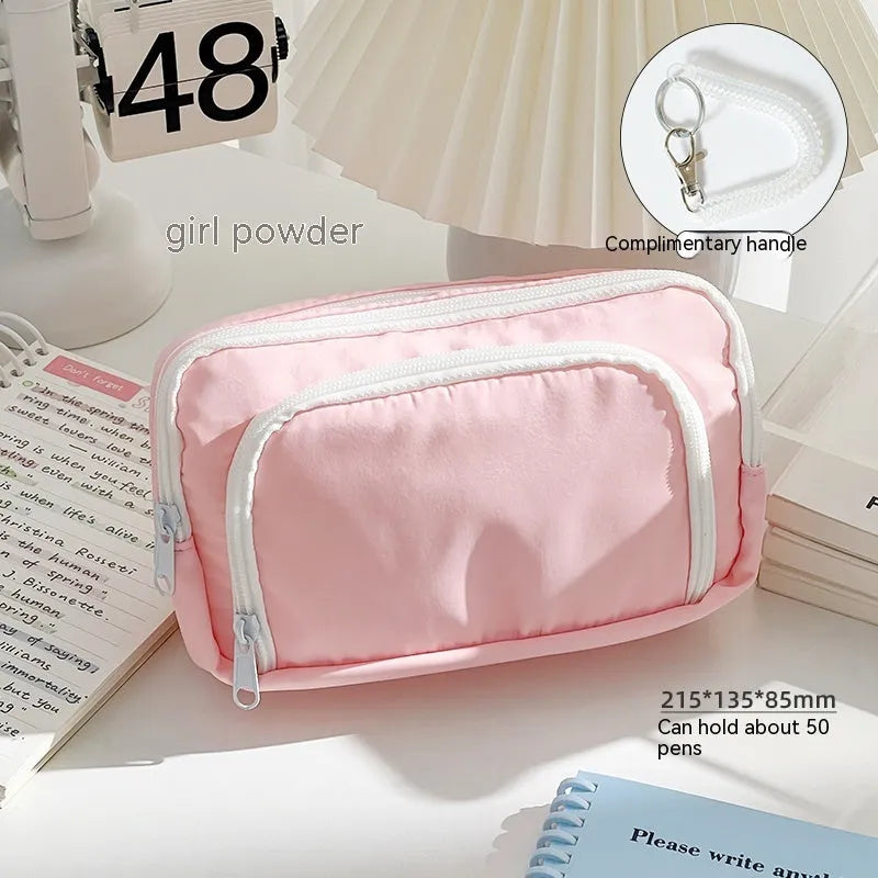 Double layer zippered pencil case in blue, cream, green, or pink with a gift handle