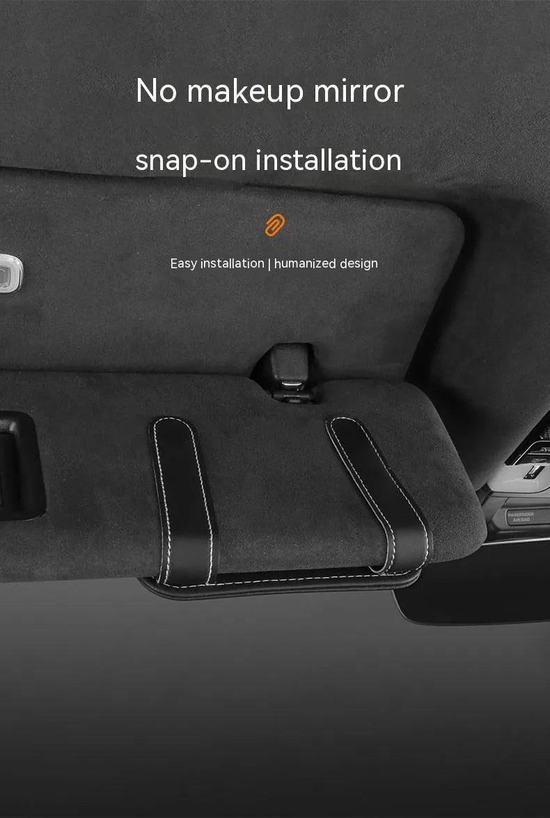 Beige first-layer cowhide leather card holder snapped onto a car's sun louver.