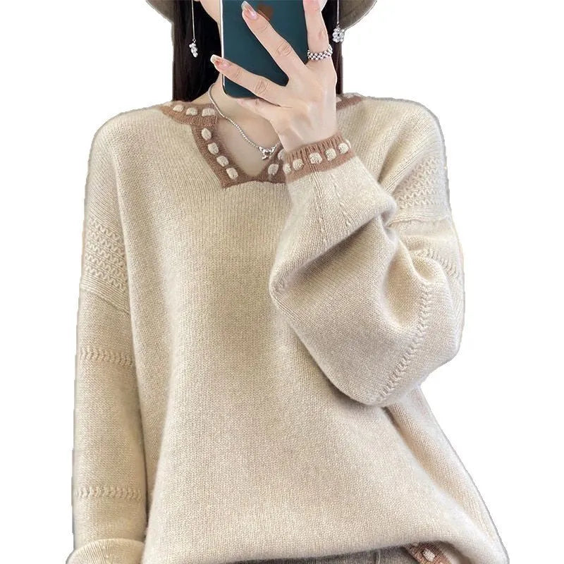 Women's camel coloured V-neck long sleeve viscose sweater laid flat.