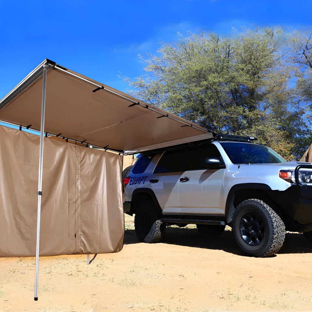 Green two-room camping tent with aluminium poles pitched in an outdoor setting