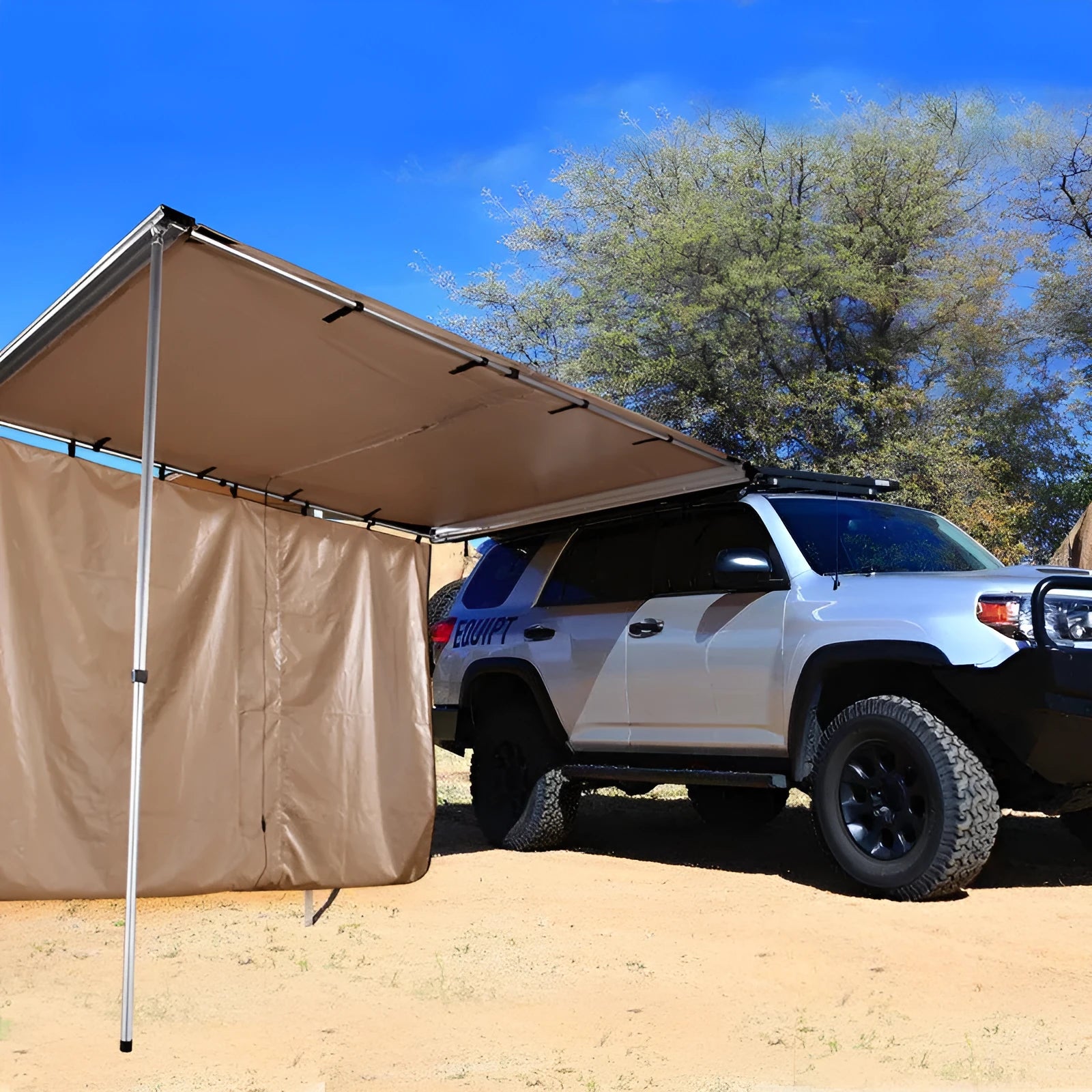 Green two-room camping tent with aluminium poles pitched in an outdoor setting