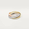 Set of three geometric U-shaped silver couple rings with diamond accents on a grey background.