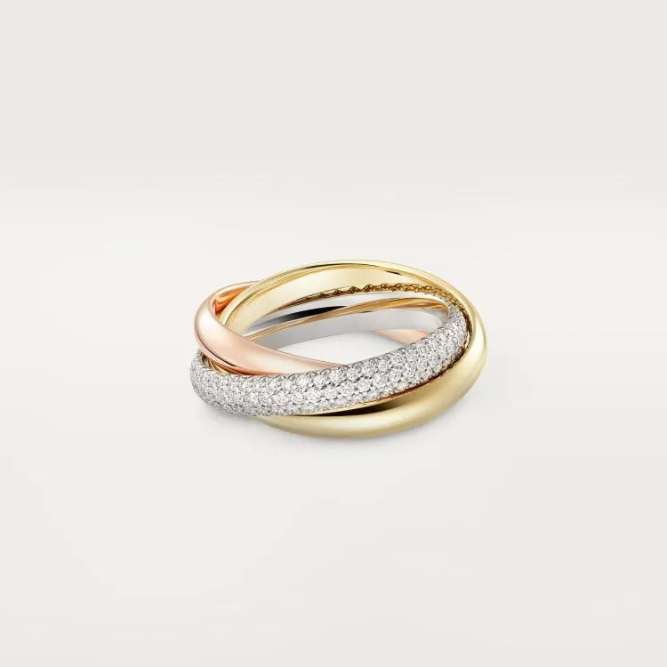 Set of three geometric U-shaped silver couple rings with diamond accents on a grey background.
