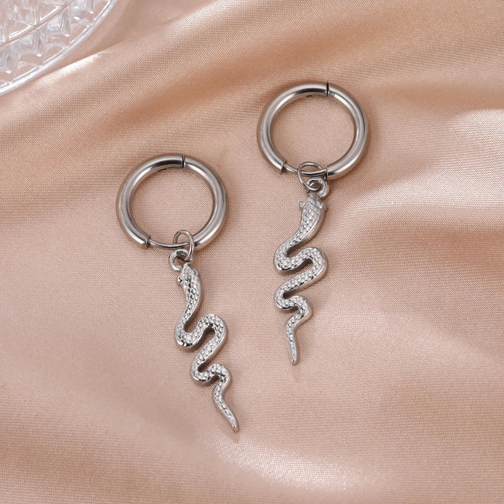 Vintage snake-shaped stainless steel earrings with gold plating in an ear clip design.