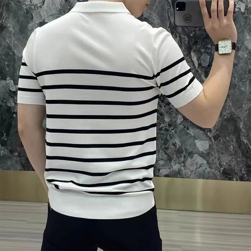 Black and white striped long-sleeve T-shirt with a lapel neckline on a hanger.