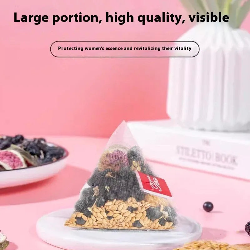 Black wolfberry mulberry flaxseed tea bags in packaging with free cup included