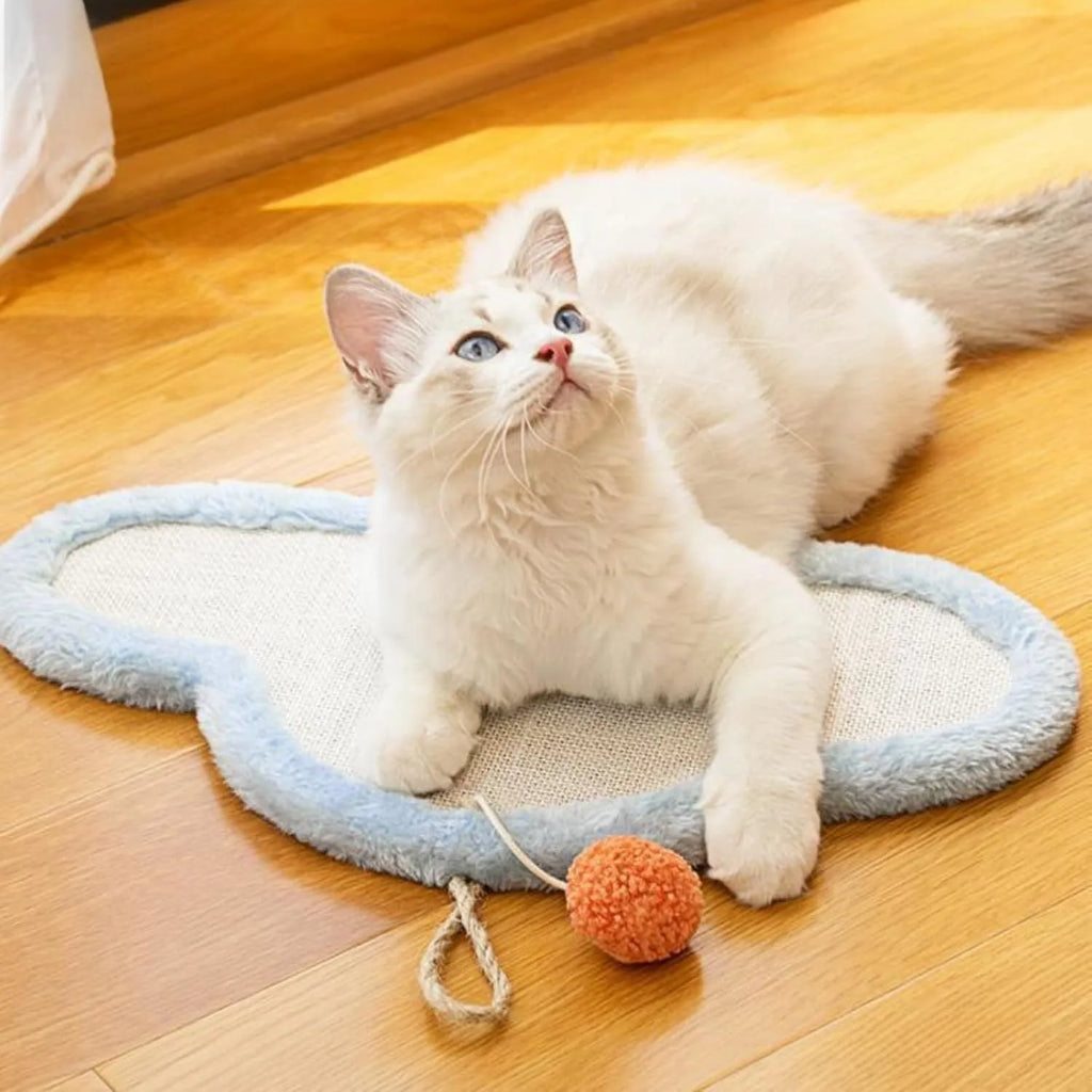 White wall mounted cat scratching mat with cartoon sleeping cat design made from natural sisal.