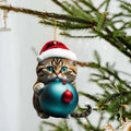 Cartoon kitty Christmas ornament hanging in a car interior, made of clear acrylic.