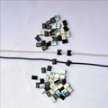 Black PA66 automotive wire clip for cable management measuring 9mm x 12mm x 6.2mm
