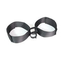 Black knitted belt strap accessory for adult sex toy appliances on plain background