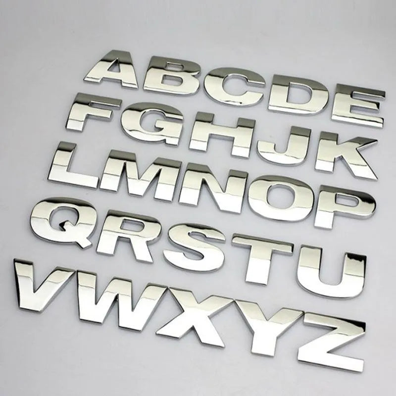 3D metal zinc alloy car bumper sticker showing a raised English letter on adhesive backing.