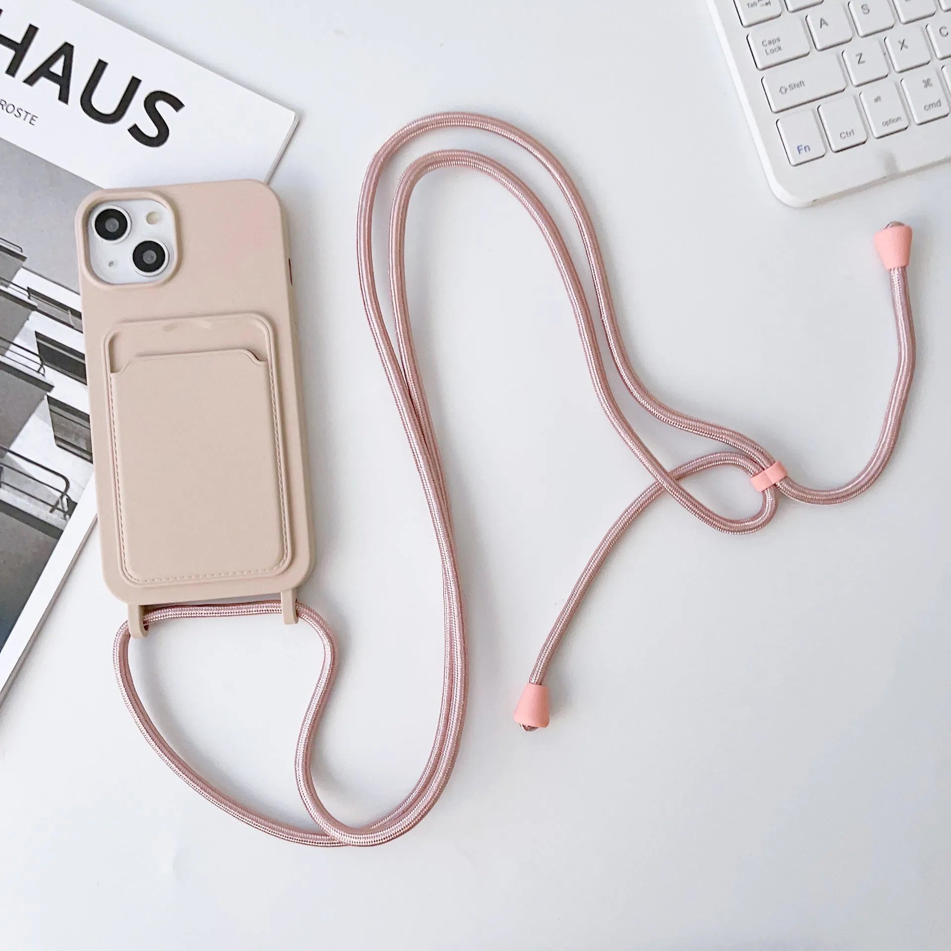 Cross body lanyard TPU phone case with card holder for Apple iPhone models, available in antique white, gray, and light pink