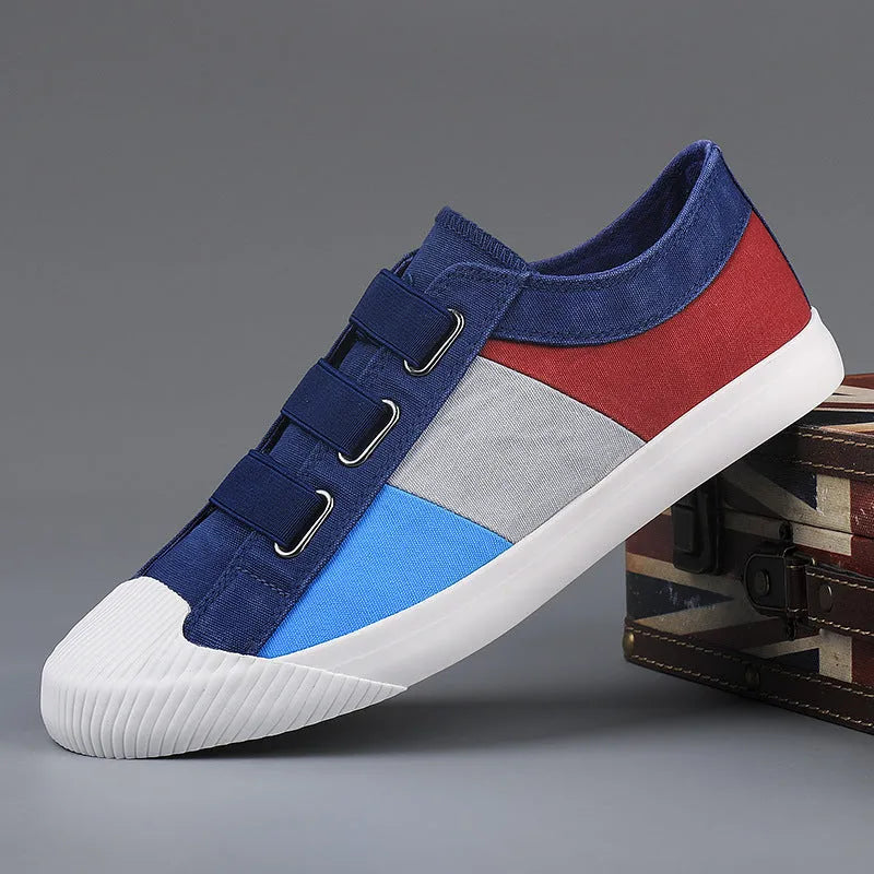 Men's low top canvas sneakers with an elastic band and vulcanised rubber sole in beige colour.