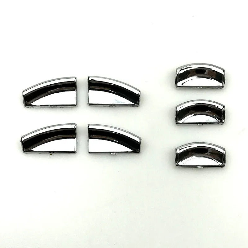 Black glitter decorative sticker for car window lift button modification on a dark background.