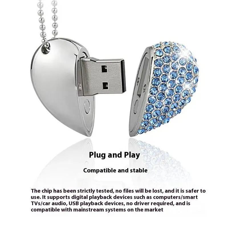 Heart-shaped silver USB drive with brick-like pattern, shown alongside blue and pink coloured versions.
