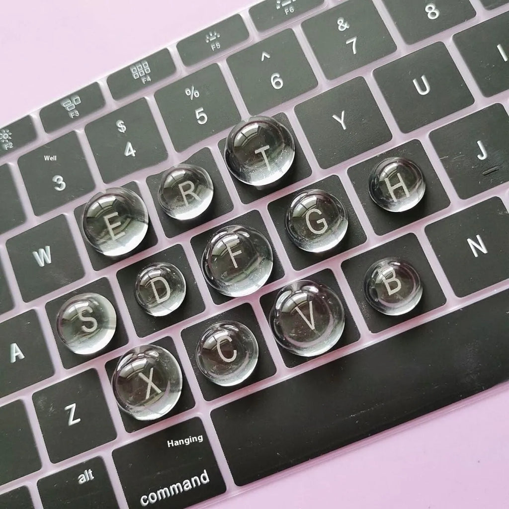 Set of PVC crystal glass ball keyboard stickers in 12x6mm size on a keyboard showing raised transparent domes