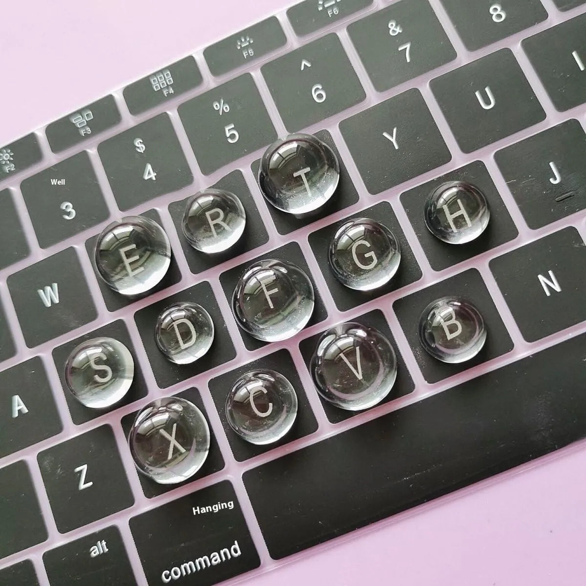 Set of PVC crystal glass ball keyboard stickers in 12x6mm size on a keyboard showing raised transparent domes
