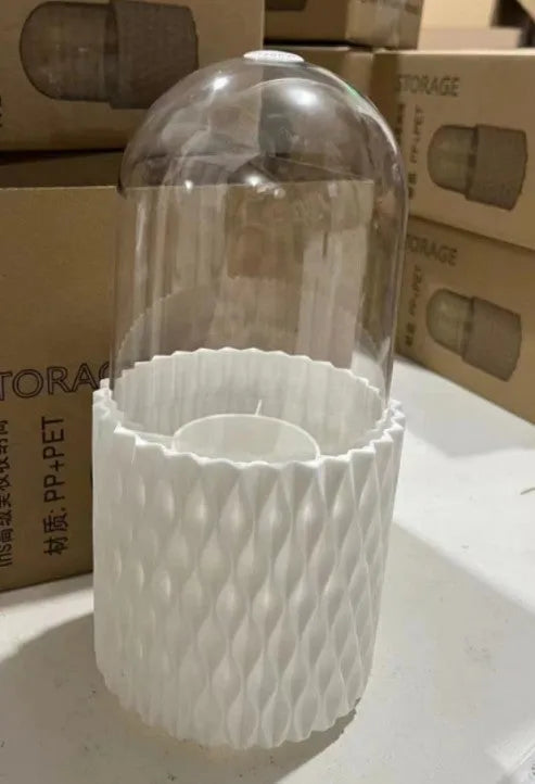 White rotating transparent makeup brush holder with dustproof lid on desktop