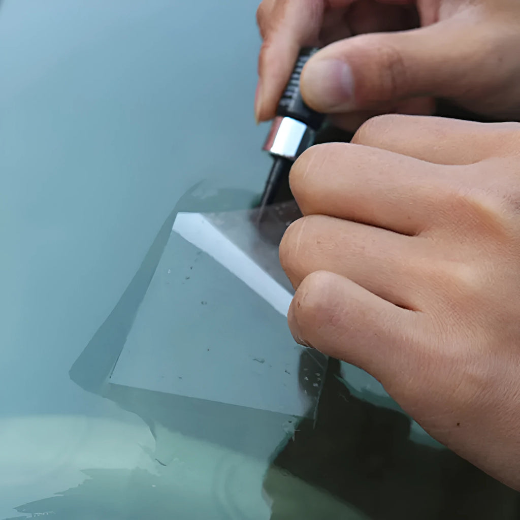 Yellow three-piece car windscreen repair kit with glass repair liquid
