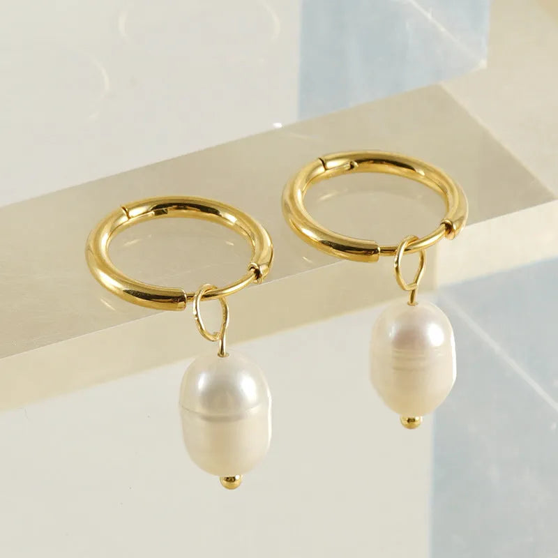 Gold geometric stainless steel earrings with pearl decorative elements for women