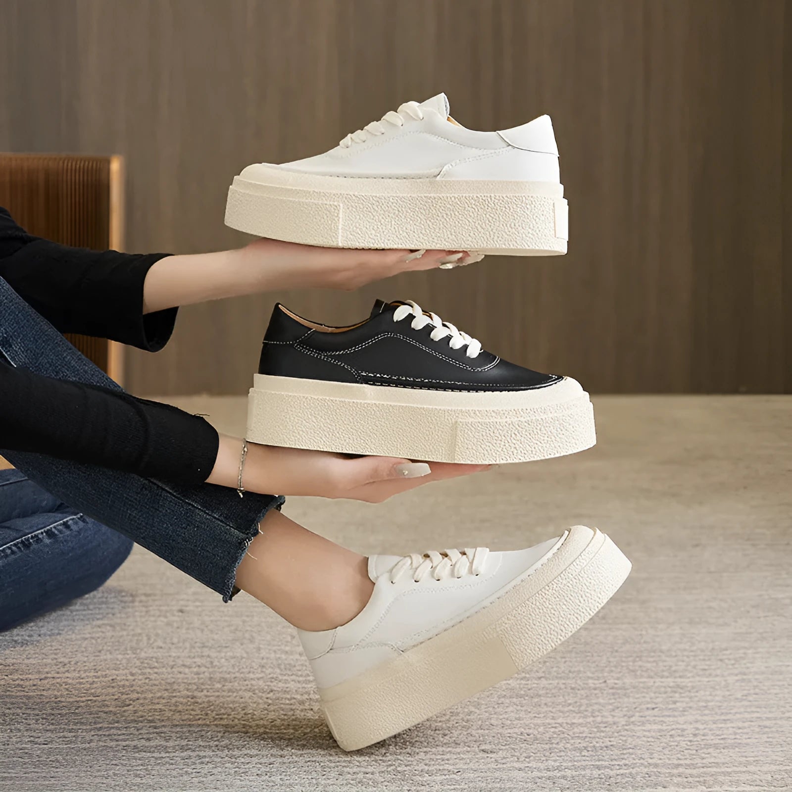 Women's black embossed cowhide leather platform sports board shoes with a round toe and white rubber sole.