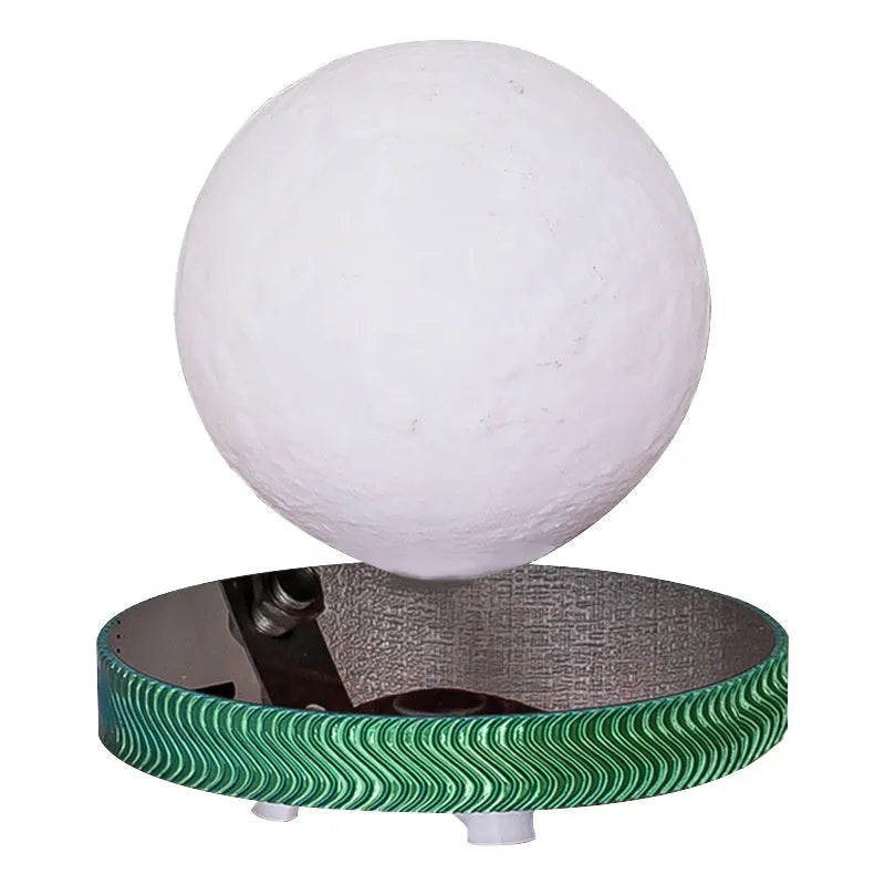 Magnetic suspension moon night lamp floating above its base with soft white glow.