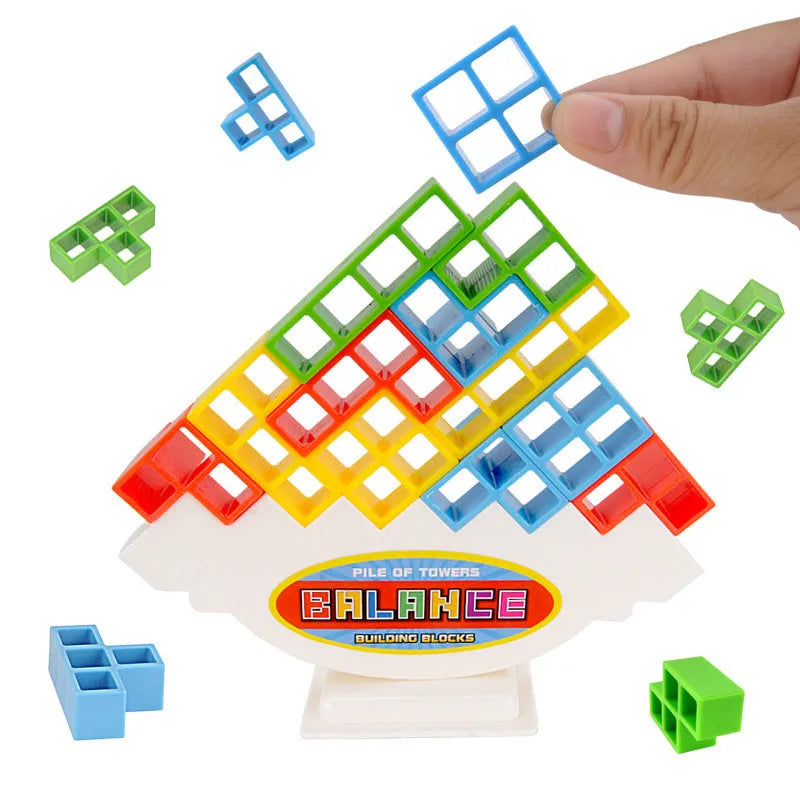 Plastic balance stacking board game with 16 colourful building blocks, a chassis, and a base on a flat surface.