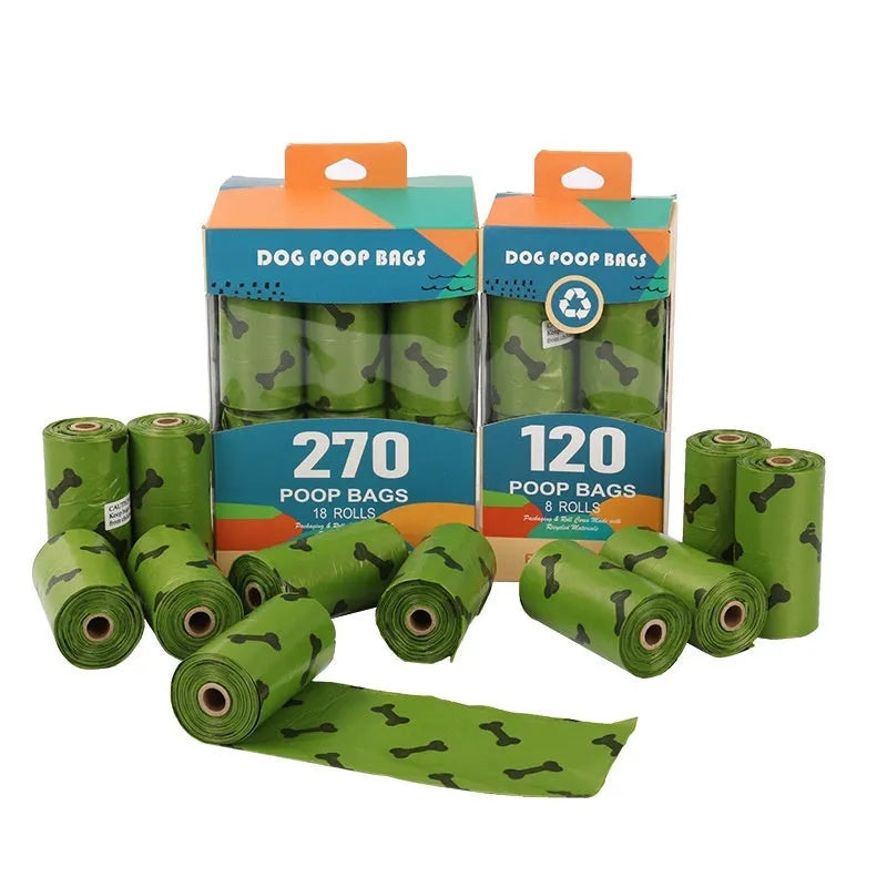 Roll of army green degradable dog poop bags with black bone print, showing bag size scale
