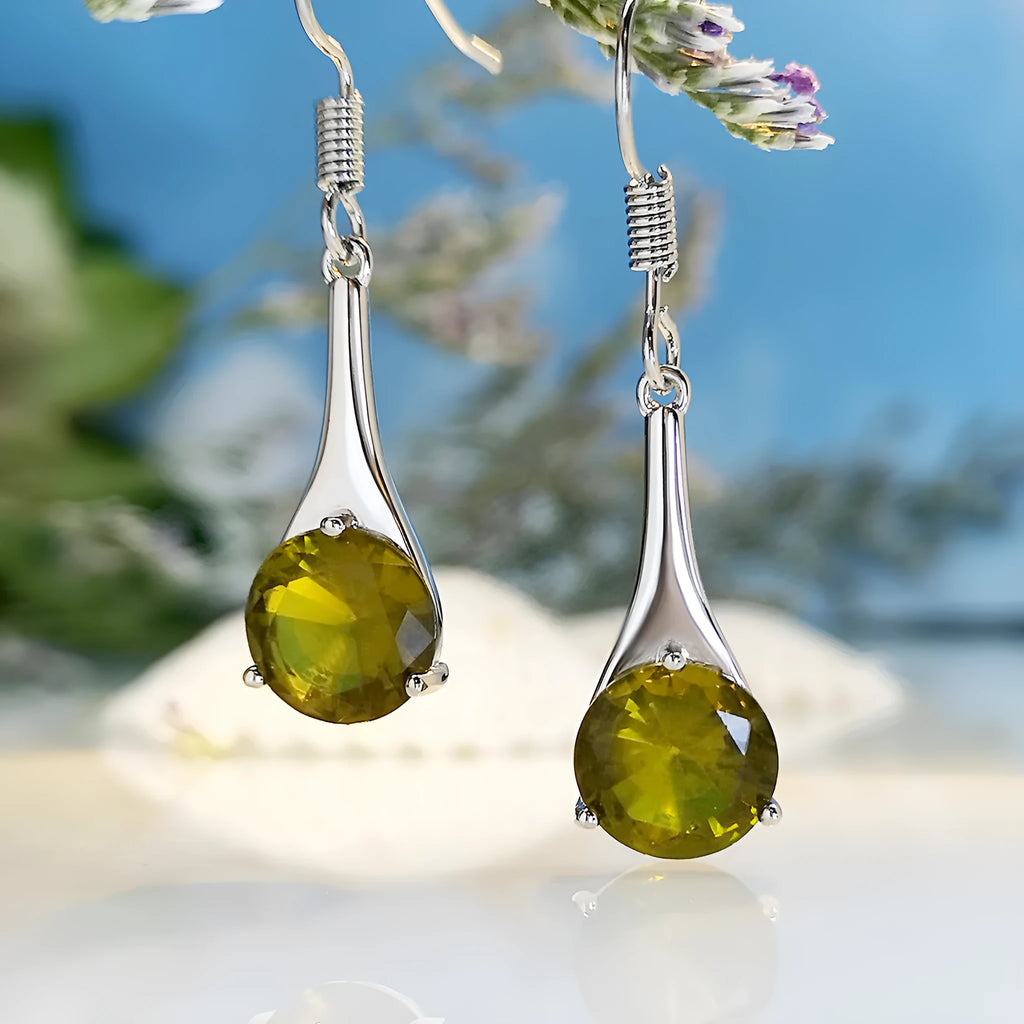 Women's olive green topaz coloured drop earrings with a simple water drop shape and retro style.
