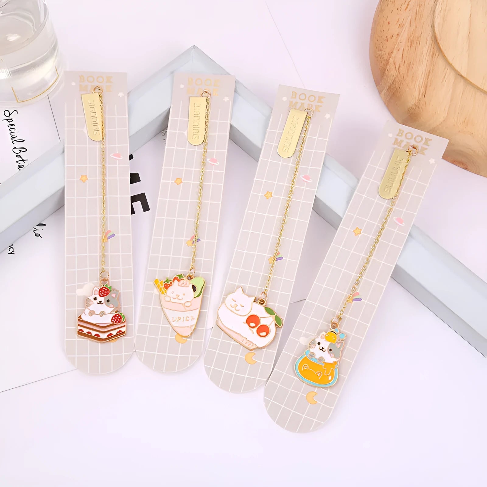 Jane Lime metal cat bookmark with food-themed designs including Strawberry Cake Cat and Cherry Sleeping Cat