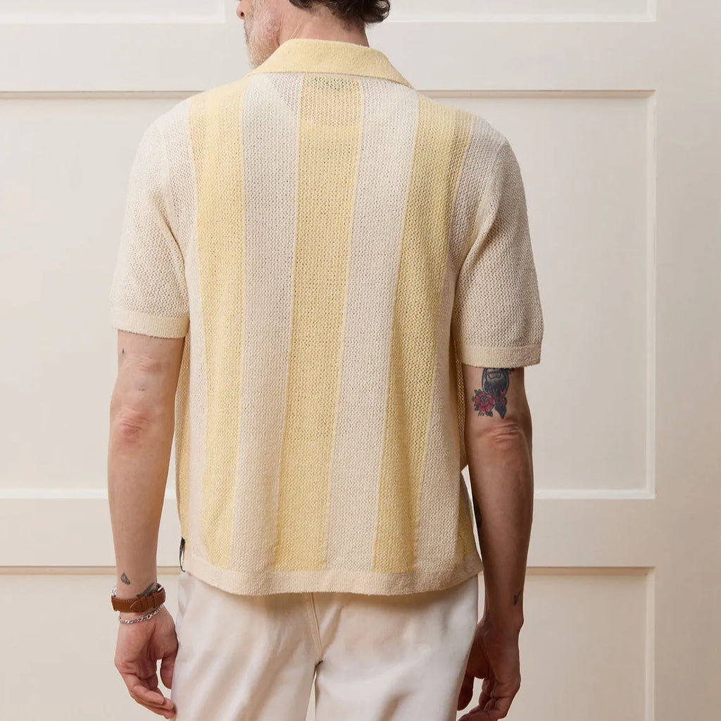 Yellow women's casual polo shirt with an asymmetrical hollow-out design and short sleeves.