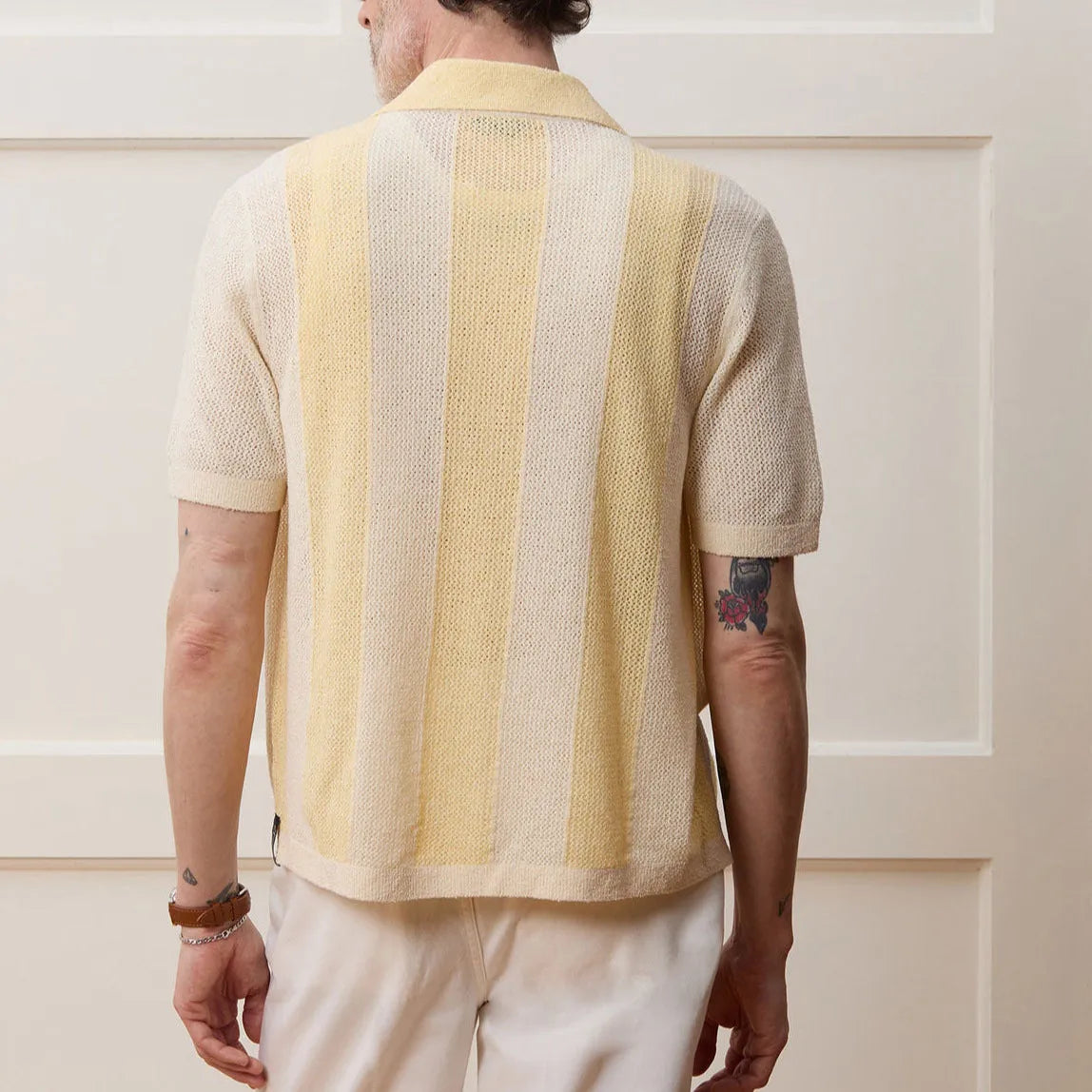 Yellow women's casual polo shirt with an asymmetrical hollow-out design and short sleeves.