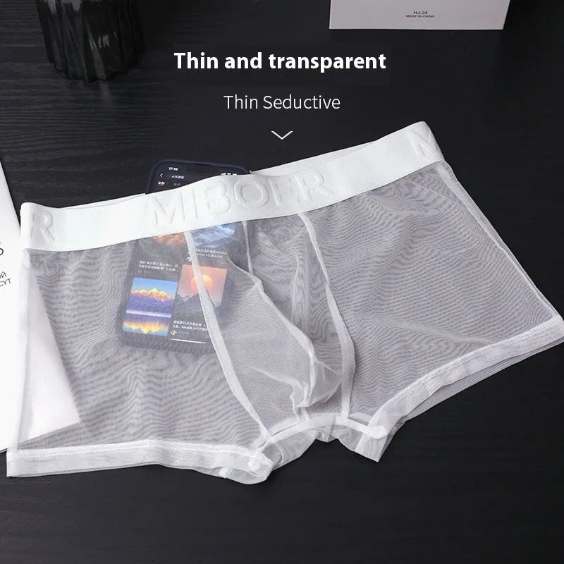 Men's solid colour thin boxer shorts in black, shown laid flat.