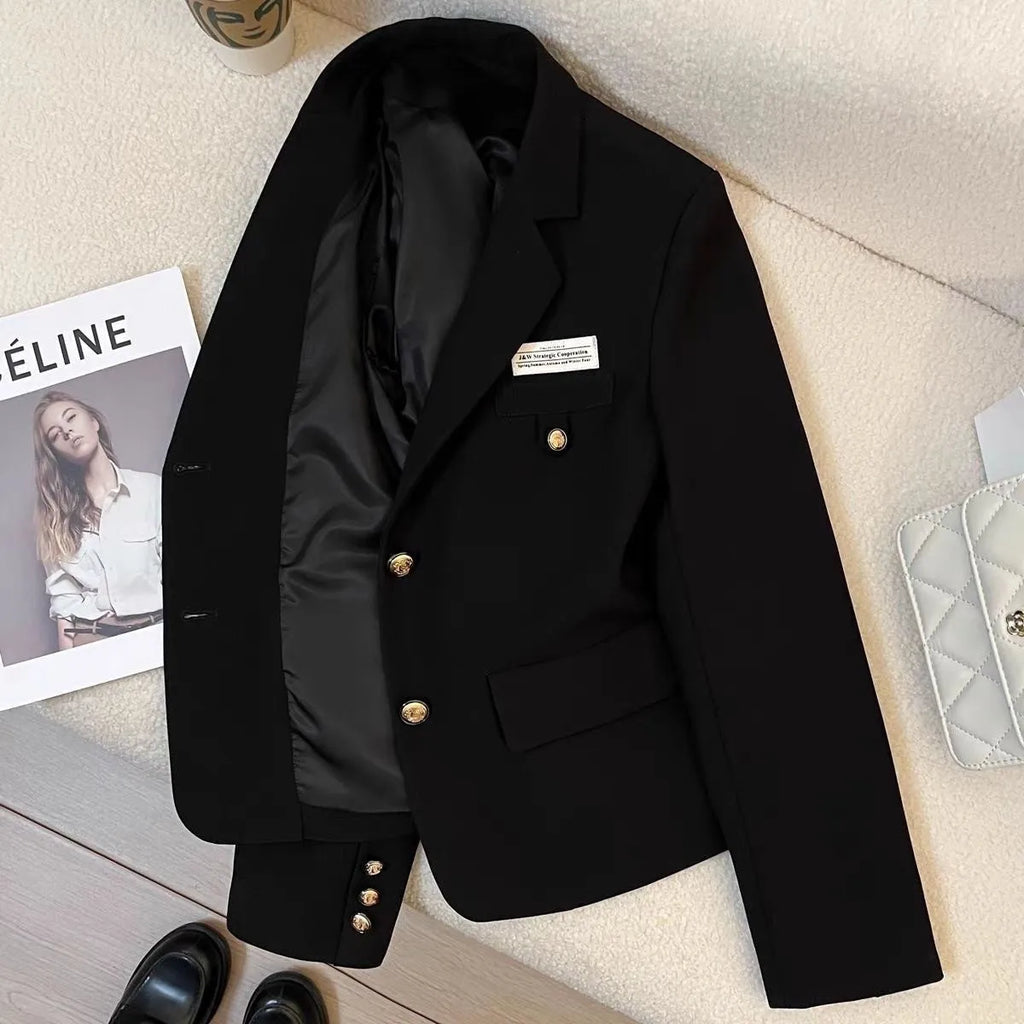 Black women's loose-fit suit coat with long sleeves and pockets for college and commute wear.