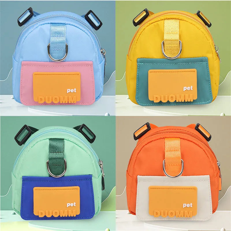 Blue adjustable dog backpack harness with storage pockets and a built-in tow rope laid flat.