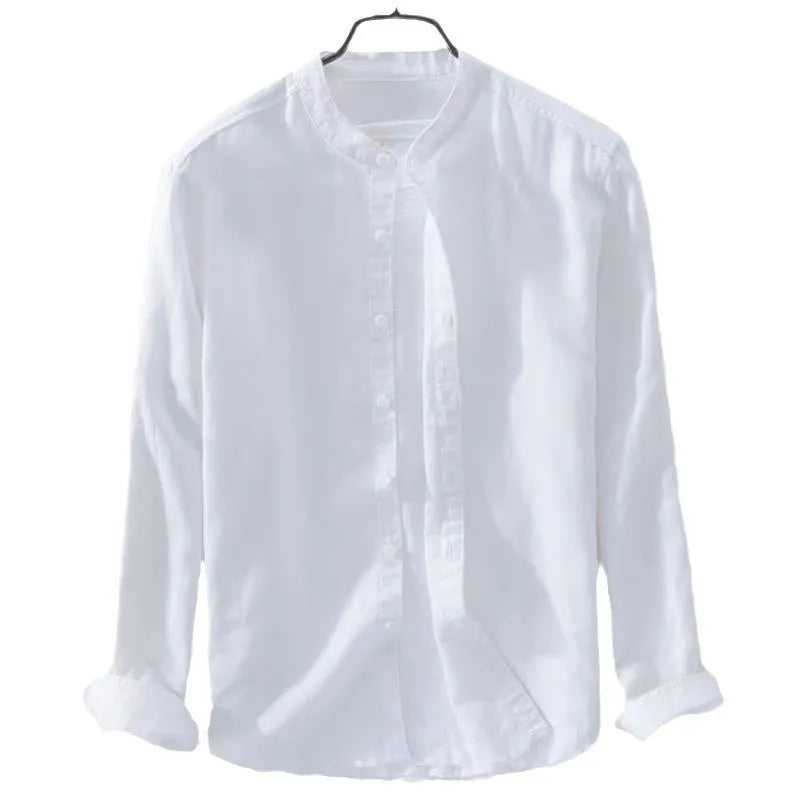 Man wearing a loose fit light blue linen blend long sleeve casual button-down shirt.