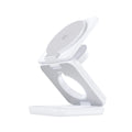 White foldable magnetic wireless charger phone holder showing compact size and charging indicator light.