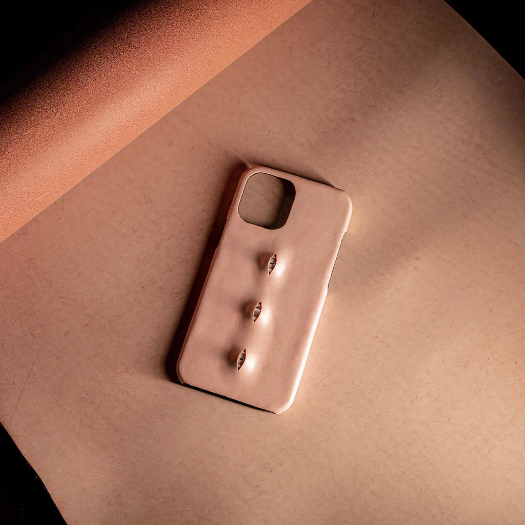 Handmade waxed cowhide leather eye phone case in pink with three-eye vertical design
