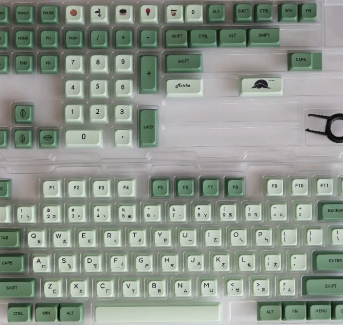 Full set of 124 matcha green PBT keycaps for a mechanical keyboard, showing various international layout options.