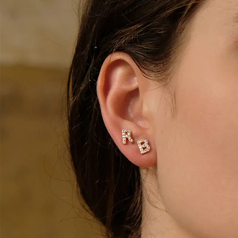 Brass gold plated alphabet letter earrings showing English characters from A to Z options
