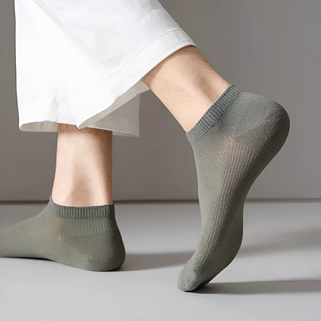Men's solid colour low-cut polyester boat socks shown in one of six available colour variants.