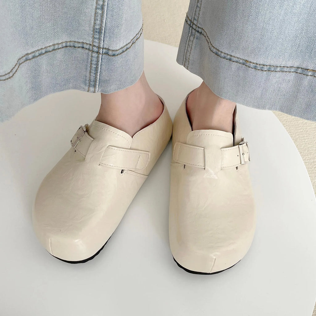 Flat buckle casual sneakers in creamy-white with round toe and PU leather upper.
