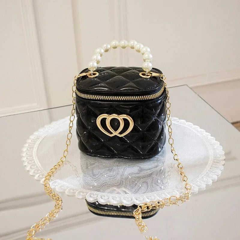 Women's PVC bucket shoulder bag with heart pattern in assorted colours