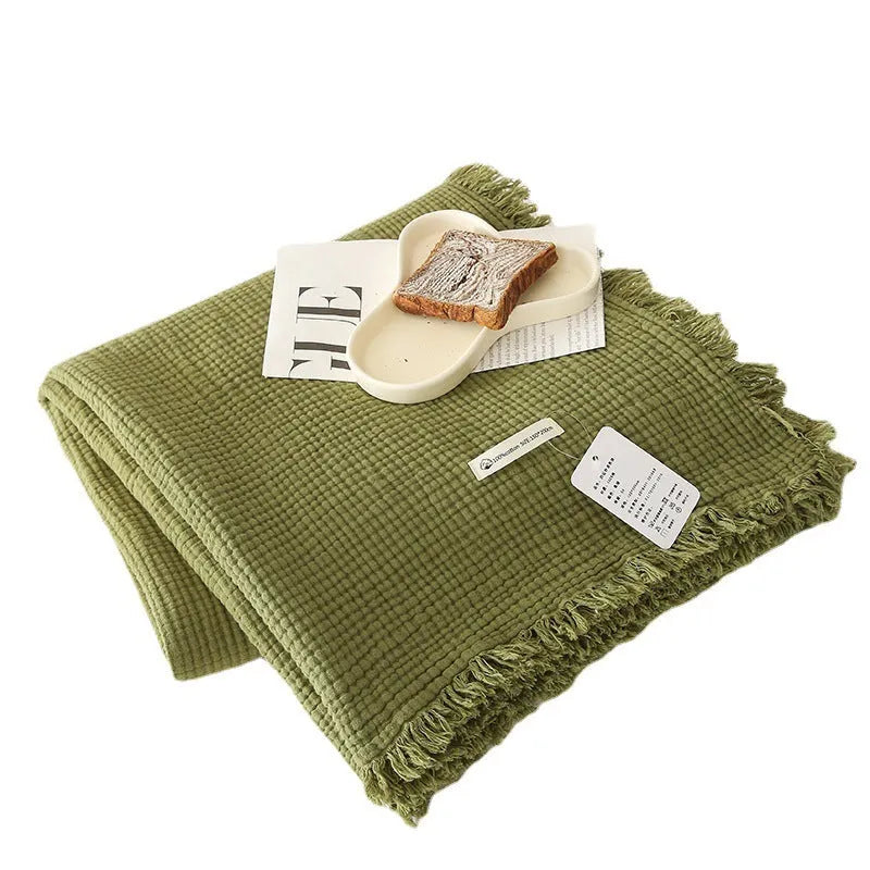 Four-layer cotton gauze blanket with tassel edge in a choice of ten colours.